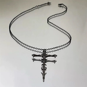 Dark gothic skeleton cross necklace with a matte black finish and vintage spine design