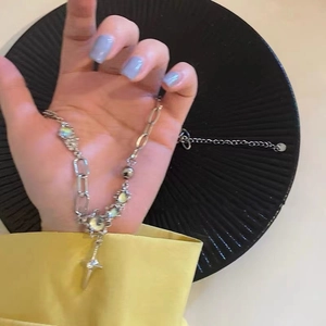 Gothic silver cross necklace with iridescent moonstones and mixed link chain style