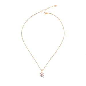 Detail of minimalist gold chain necklace with a round white enamel letter B pendant charm