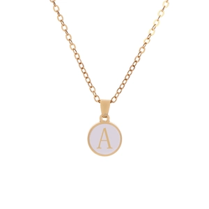 Macro shot of gold coin pendant with letter A and pink enamel on a slim cable chain
