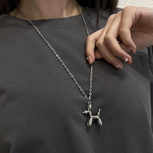 Detailed view of silver balloon dog pendant on a sleek titanium steel chain necklace