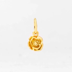 Detail of gold flower pendant featuring frosted petals and polished edges