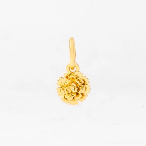 Macro shot of 12-month flower pendant with detailed gold petals and polished bale