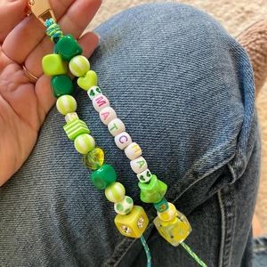 Handmade Matcha beaded keychain featuring green heart and star beads with gold metal clasp