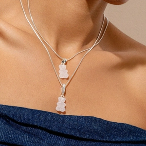 Layered silver necklaces featuring sugar-textured bear pendants with sparkling zircon details