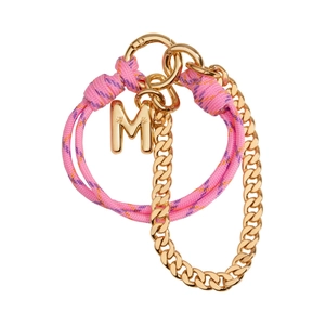 Detailed macro view of pink braided rope with golden chain and letter M bag charm