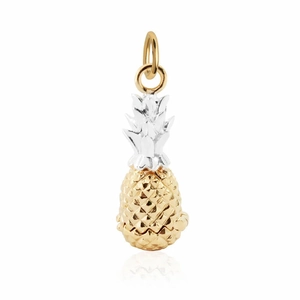 Macro view of pineapple charm pendant with gold body and silver textured leaves