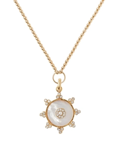 Close-up of 14k gold-plated beaded necklace with sparkling zircon and mother-of-pearl pendant