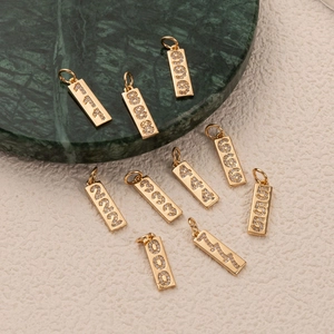 18K gold plated rectangular lucky number pendants with zircon stones on green marble base