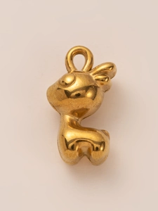 Detailed view of an 18K gold plated cartoon deer pendant with a polished shiny finish