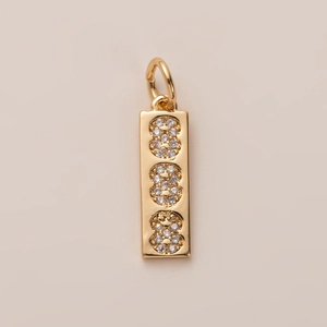 Detailed close-up of 18K gold plated rectangular pendant with three CZ stones