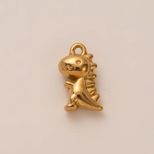 Detail showing the glossy 18K gold-plated dinosaur pendant with unique dorsal fin texture
