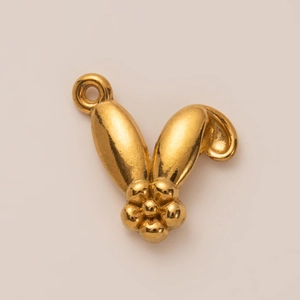 Close-up of a 18K gold-plated bunny ear pendant with a detailed 3D flower and bail