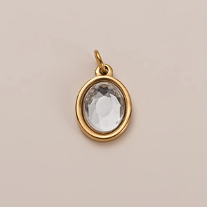 Pendente ovale dorato con zircone trasparente incastonato a castone
