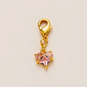 Pink heart-shaped pendant with gold-plated lobster clasp and four-prong gemstone setting