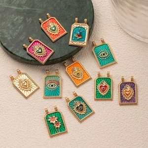 Retro tarot style gold titanium steel pendants with colorful enamel heart and eye designs