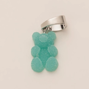 Detail of sky blue gummy bear pendant with frosted texture and silver metal clasp