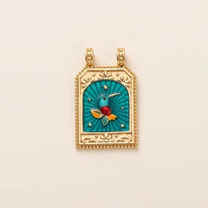 Detailed close-up of a gold tarot pendant with a colorful hummingbird enamel design