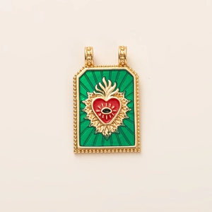 Detail showing tarot-style rectangle pendant with green enamel and sacred heart design
