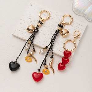 Bijou de Sac Cœur en Alliage Corde Tressée Bohème Perle Artificielle Pendentif Mauvais Œil Porte-Clés Décoration Sac à Main Femme