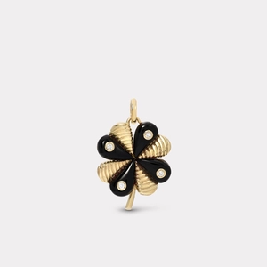 Détail macro du pendentif trèfle à huit pétales en or 18K, onyx noir et micro-cristaux