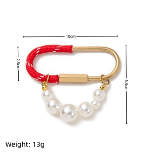 Red and white braided rope keychain with white pearls and gold D-ring pendant