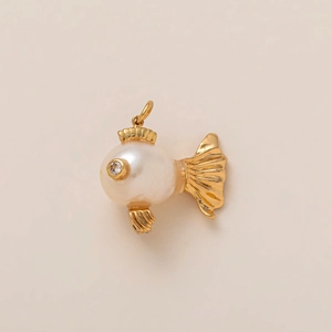 Detail of fish pendant featuring a large round pearl and 18K gold plated metal fins