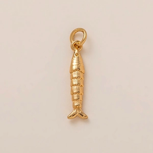 Detailed close-up of a 18K gold plated fish-shaped pendant with realistic scales