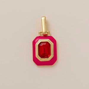 Detail of 18K gold plated strawberry pendant with red rectangular stone and pink enamel