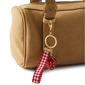 Chic strawberry keychain charm with red enamel, gingham ribbon, and gold-tone metal clasp