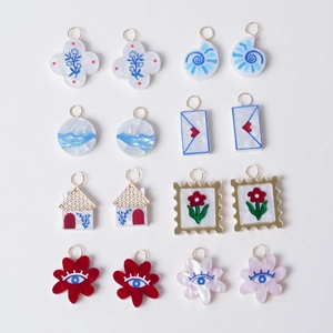 18K gold-plated acrylic charms featuring botanical and fruit motifs on a white background