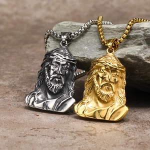 Hip hop style Jesus face pendant necklaces in silver and gold finishes on rock background