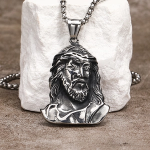Detailed close-up of Jesus Christ head pendant with thorn crown and heavy steel chain