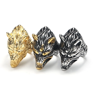 Three Viking wolf head rings in gold, silver, and black finish with detailed fur textures