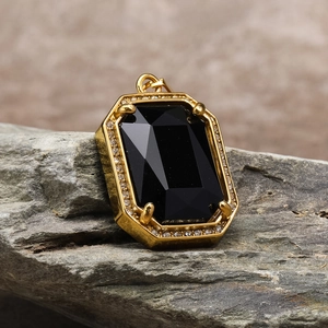 Close-up of hip hop square black gemstone pendant with gold-plated zircon setting