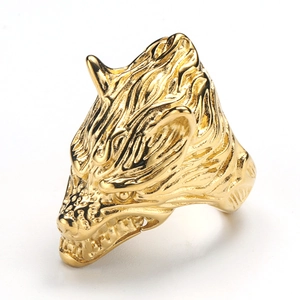 Detailed view of golden Viking wolf head ring with intricate Nordic punk carvings