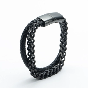 Close-up of black multilayer braided leather and titanium steel curb chain men's bracelet