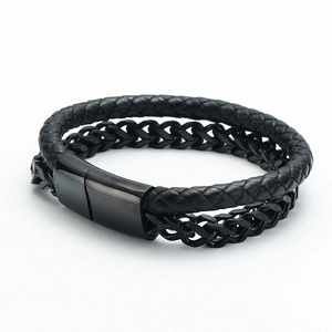 Detailed macro of black braided leather and polished metal chain men's bracelet