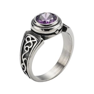 Detailed close-up of retro titanium steel men's ring with a faceted purple gemstone