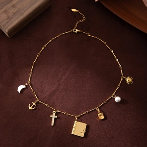 18K gold plated stainless steel necklace with cross, crescent, and sun charms