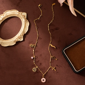 Gold-plated stainless steel charm necklace with colorful zodiac symbols and heart key charms