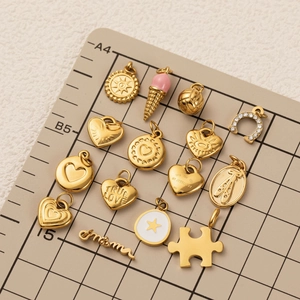 Selection of 18K gold plated stainless steel pendants including heart and horseshoe shapes