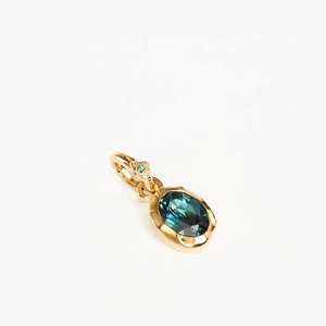 Pendentif pierre de naissance doré texturé avec une pierre précieuse bleue ovale facettée