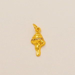 Detailed view of a golden conch pendant with sparkling white cubic zirconia stones