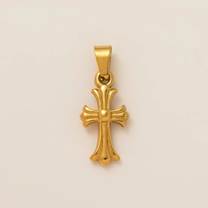 Macro shot of 18K gold plated stainless steel cross pendant with polished finish