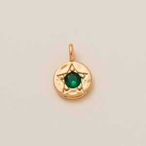Detail of 18K gold-plated star pendant with inlaid green zircon and polished jump ring