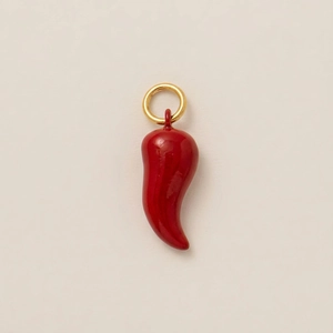 Detailed view of red chili pendant with gold-plated ring and glossy enamel finish