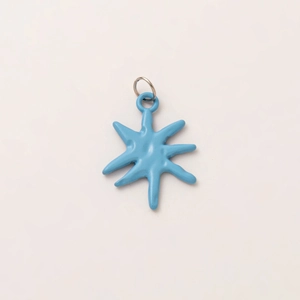 Close-up of sky blue octagonal star pendant with 18K gold plated metal ring