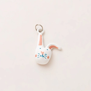 Detail showing hand-painted ceramic rabbit pendant with 18K gold plated metal ring