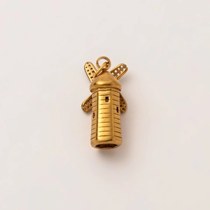 Close-up of 18K gold plated stainless steel windmill pendant with hollow mesh blades